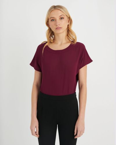 Forcast Clothing, the Sonia Round-Neck Blouse. Crafted from a light material, this minimal design with batwing style sleeves embodies versatility