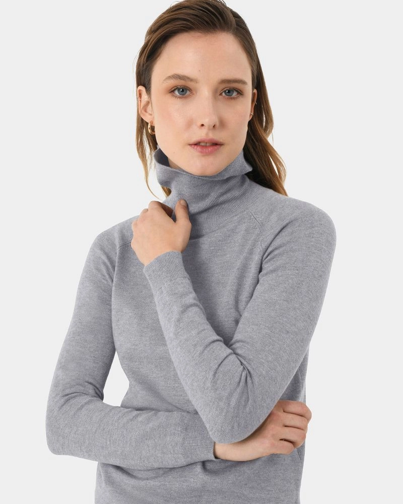 Forcast Clothing, the Clarisse Turtleneck Sweater, featuring a classic rolled turtleneck design and ribbed detail edges