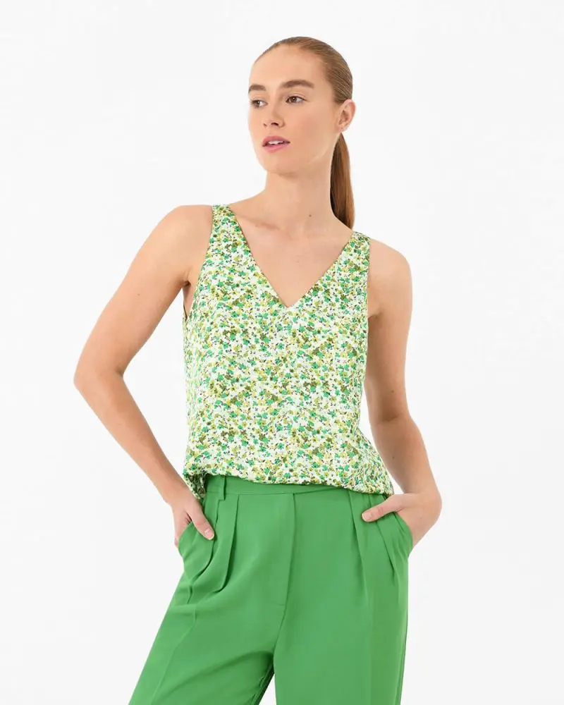 Forcast Clothing, the Isela Floral V-Neck Tank Top, featuring ditsy floral print sprinkled across the simple tank style 